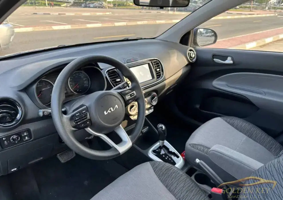 Dubai Airport Transfer - With Kia Pegas 2024 - Golden Key Rent Car LLC